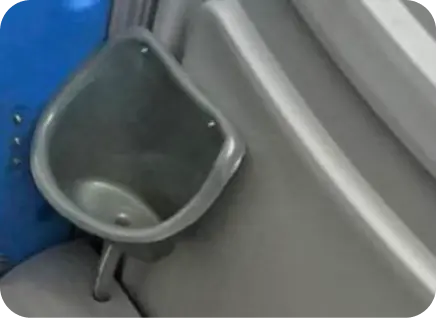 Urinal attachment in portable toilet, showcasing durable design and accessibility features for outdoor activities and events.