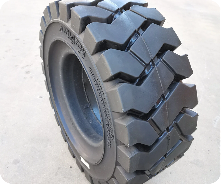 Solid tyre designed for forklifts, featuring a robust tread pattern for enhanced durability and stability in industrial environments.